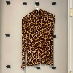 Cheeta print turtle neck by Jennifer Lopez. Perfect for layering